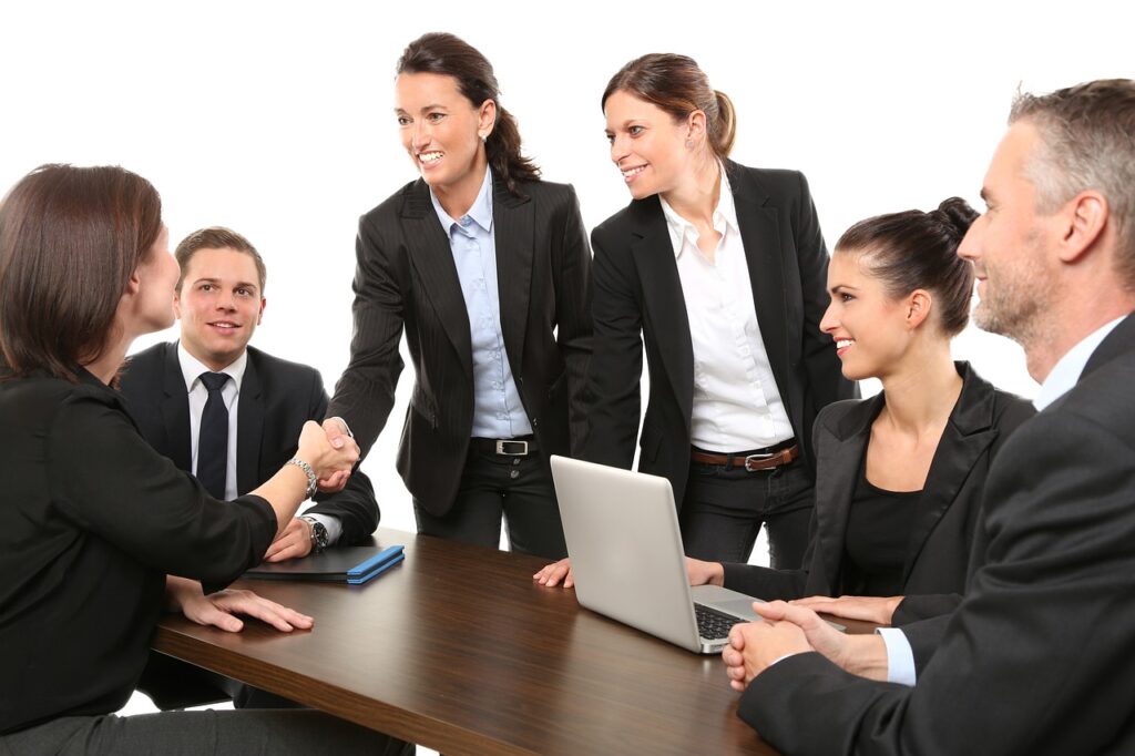 Team members shaking hands